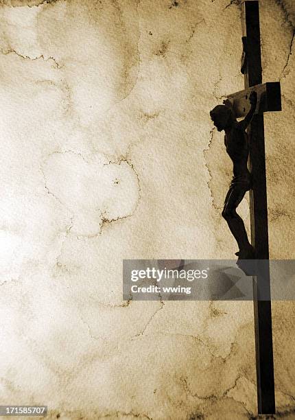 crucifix on stained paper with lots of copy space - the passion of jesus bildbanksfoton och bilder