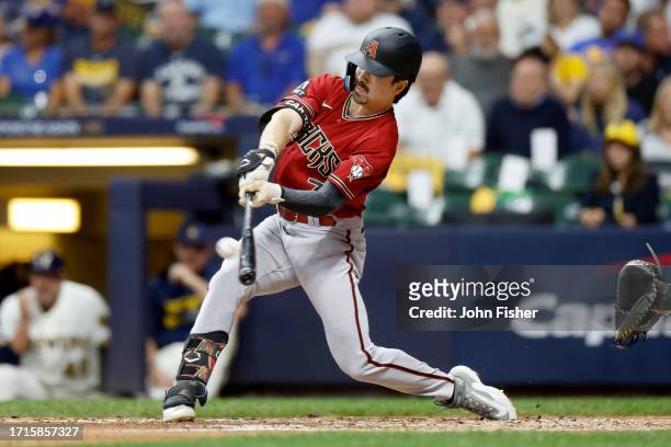 Corbin Carroll of the Arizona Diamondbacks hits a home run in the third inning against the Milwaukee Brewers during Game One of the Wild Card Series...