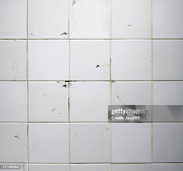 texture of the old tile wall with cracks - betegelde vloer stockfoto's en -beelden