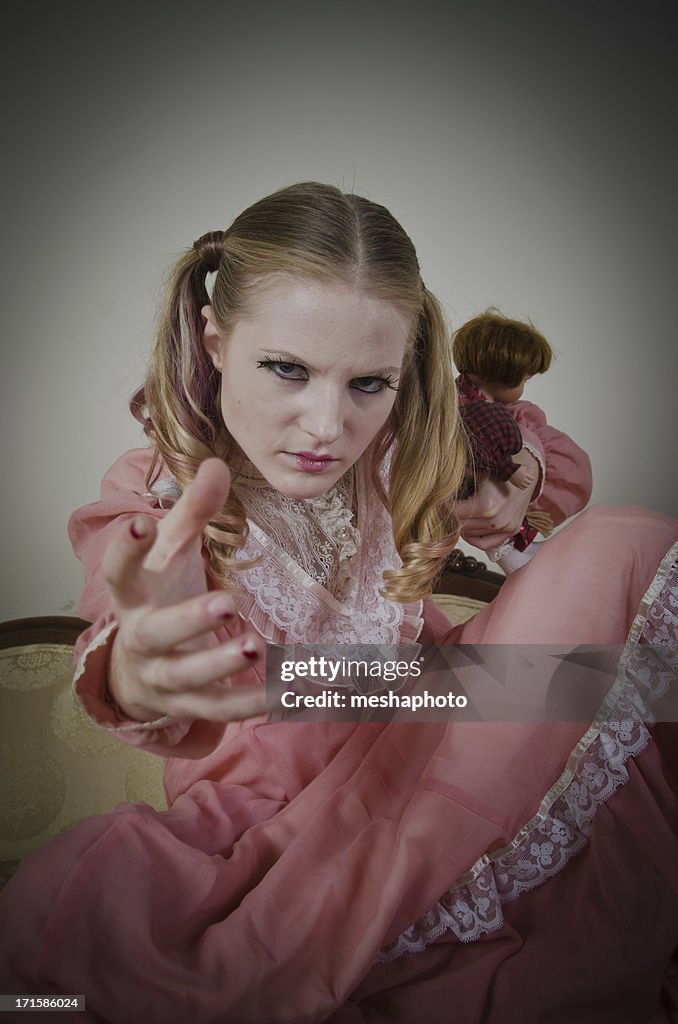 Crazy Girl Holding Doll