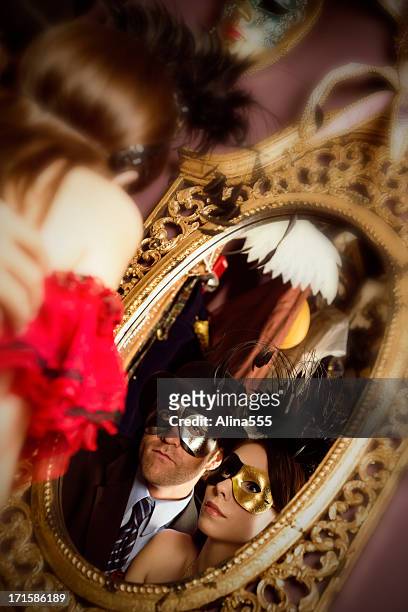 couple getting ready for the masquerade ball - masquerade ball stock pictures, royalty-free photos & images