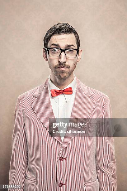 vintage fancy dressed nerd with bow tie and glasses - rood jak stockfoto's en -beelden