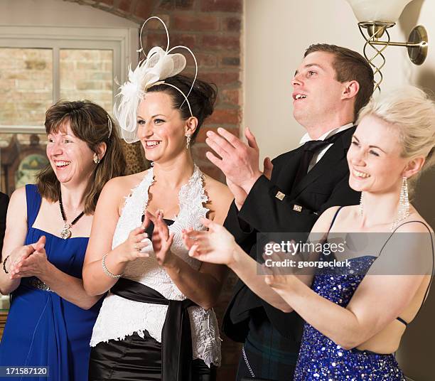 applauding a speech - black tie party fancy stock pictures, royalty-free photos & images