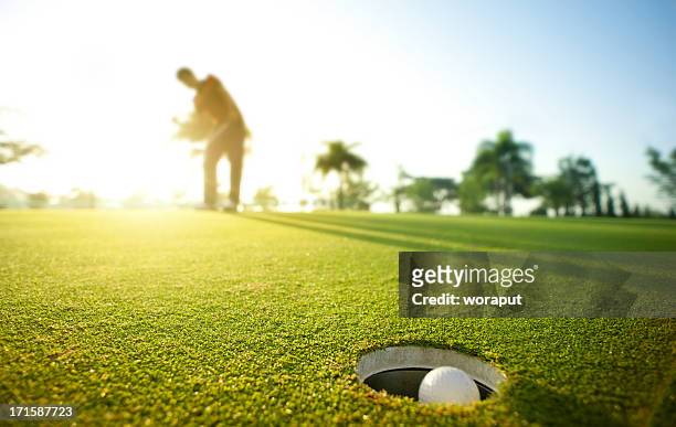 morning putt - golf putter stock pictures, royalty-free photos & images