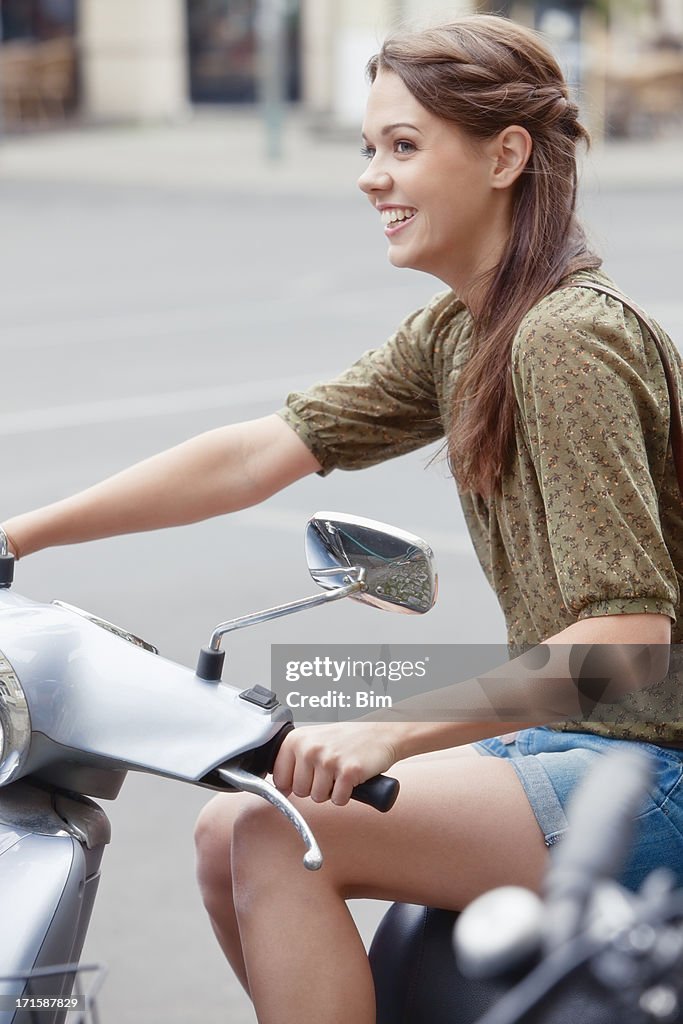 Young Beautiful Woman on Scooter