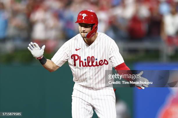 Trea Turner of the Philadelphia Phillies celebrates hitting a double during the first inning against the Miami Marlins in Game One of the Wild Card...