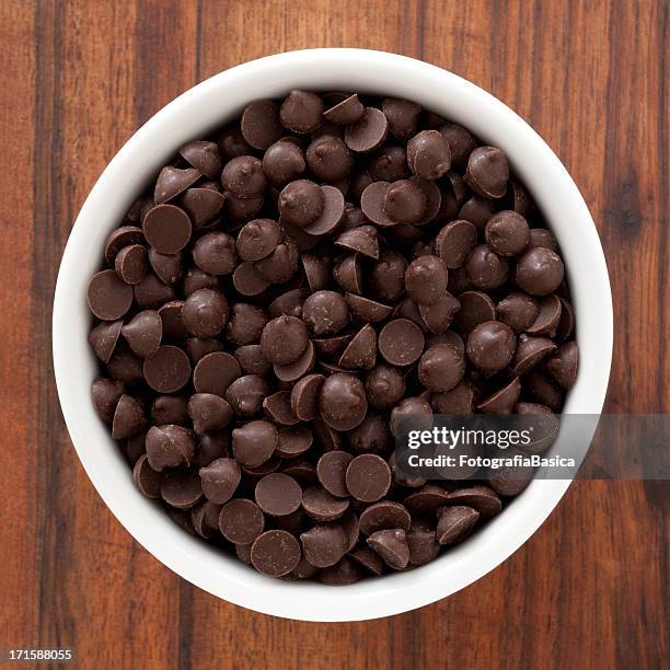 chocolate chips - chocolate chips stock pictures, royalty-free photos & images