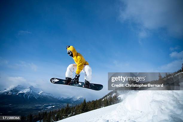 man snowboarding in the mountain - radical snowboarding stock pictures, royalty-free photos & images