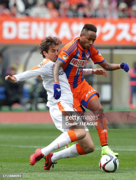 Rafael Silva of Albirex Niigata and Dejan Jakovic of Shimizu S-Pulse compete for the ball during the J.League J1 first stage match between Albirex...