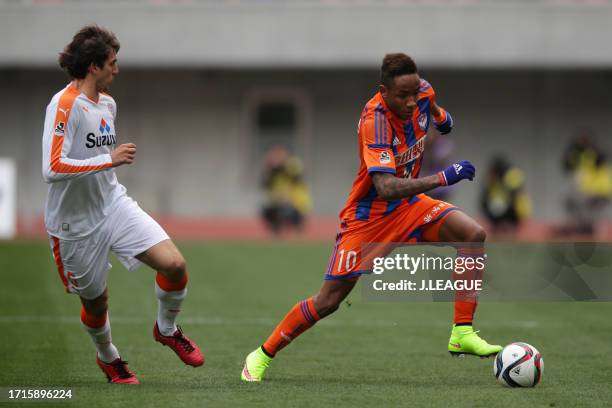 Rafael Silva of Albirex Niigata controls the ball against Dejan Jakovic of Shimizu S-Pulse during the J.League J1 first stage match between Albirex...