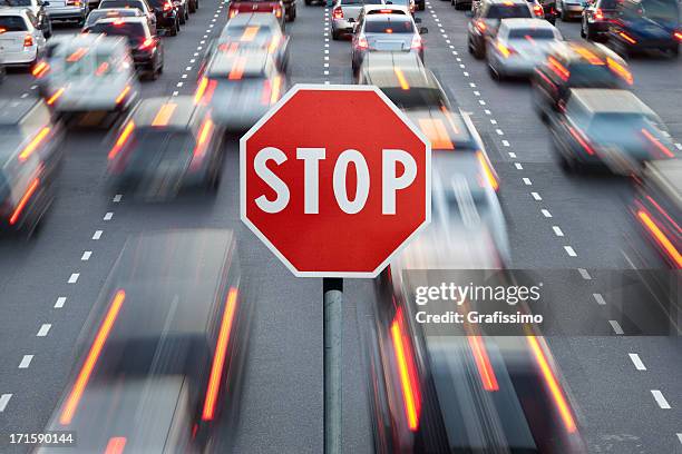 stop sign and cars at rush hour - avenida 9 de julio stock pictures, royalty-free photos & images