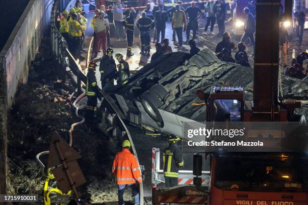 Emergency crew members work at the scene after a bus accident near Venice on October 03, 2023 in Mestre, Italy. A bus belonging to the transport...