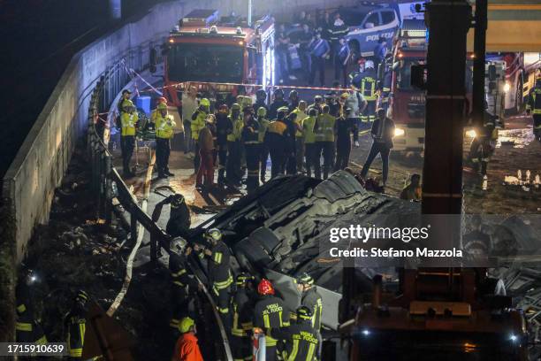 Emergency crew members work at the scene after a bus accident near Venice on October 03, 2023 in Mestre, Italy. A bus belonging to the transport...