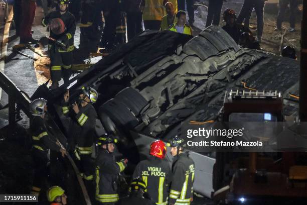 Emergency crew members work at the scene after a bus accident near Venice on October 03, 2023 in Mestre, Italy. A bus belonging to the transport...