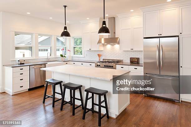 new kitchen in modern luxury home - lighting equipment stock pictures, royalty-free photos & images