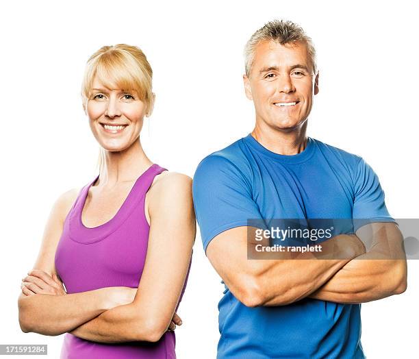 mature couple in fitness wear (isolated on white) - adult male vest exercise stock pictures, royalty-free photos & images