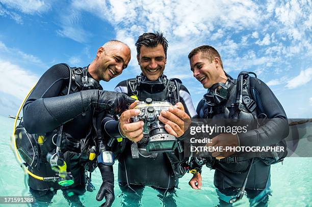 looking at pictures - scuba regulator stock pictures, royalty-free photos & images