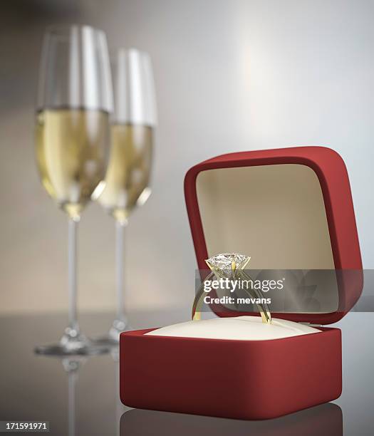 marriage proposal concept with ring and two glasses of wine - diamond ring stock pictures, royalty-free photos & images