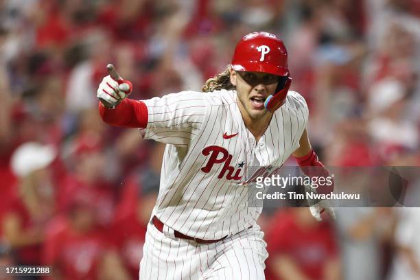 Alec Bohm of the Philadelphia Phillies reacts after hitting a one-run RBI double during the third inning against the Miami Marlins in Game One of the...
