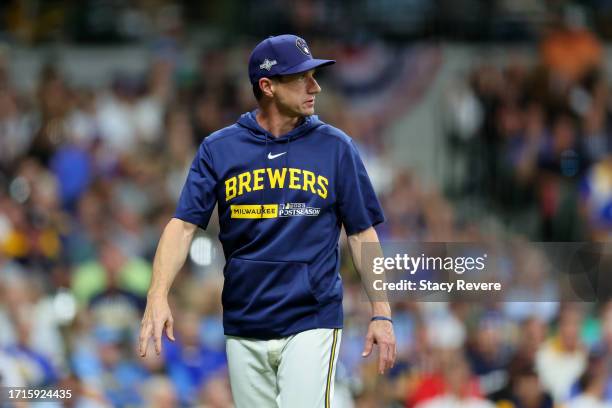 Manager Craig Counsell of the Milwaukee Brewers walks across the field in the fifth inning against the Arizona Diamondbacks during Game One of the...