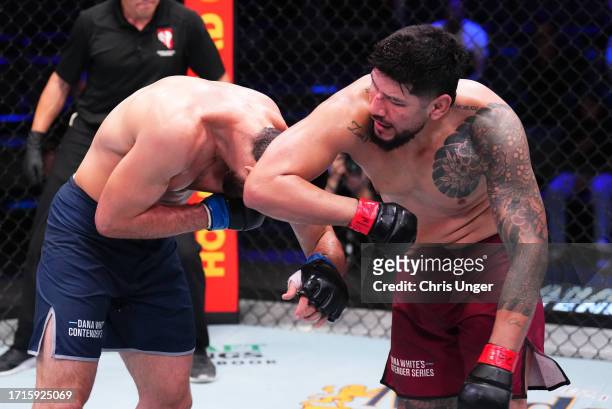 Jose Medina of Bolivia elbows Magomed Gadzhiyasulov of Russia in a light heavyweight fight during Dana White's Contender Series season seven, week...