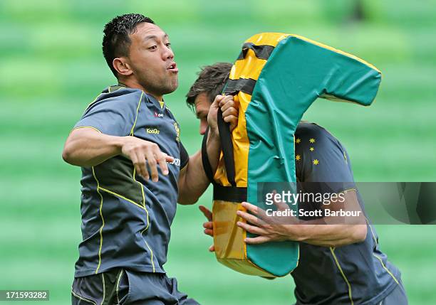 Christian Leali'ifano of the Wallabies tackles during an Australian Wallabies training session at AAMI Park on June 27, 2013 in Melbourne, Australia.