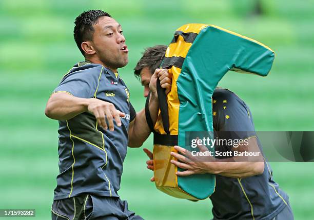 Christian Leali'ifano of the Wallabies tackles during an Australian Wallabies training session at AAMI Park on June 27, 2013 in Melbourne, Australia.