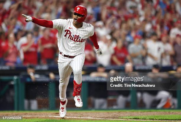 Cristian Pache of the Philadelphia Phillies reacts after hitting a one-run RBI single during the fourth inning against the Miami Marlins in Game One...