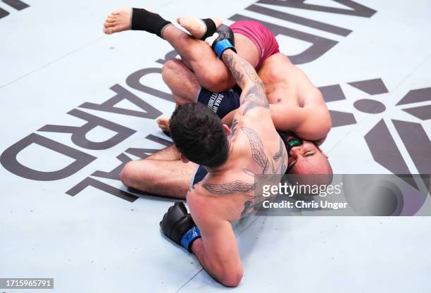 Victor Hugo of Brazil works for a submission against Eduardo Torres Caut of Chile in a bantamweight fight during Dana White's Contender Series season...