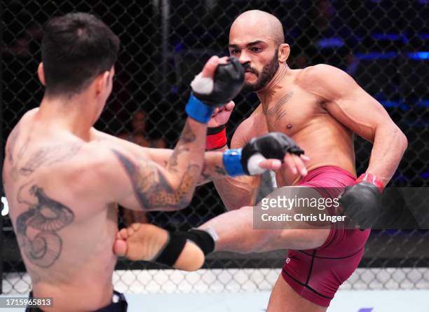 Victor Hugo of Brazil kicks Eduardo Torres Caut of Chile in a bantamweight fight during Dana White's Contender Series season seven, week nine at UFC...