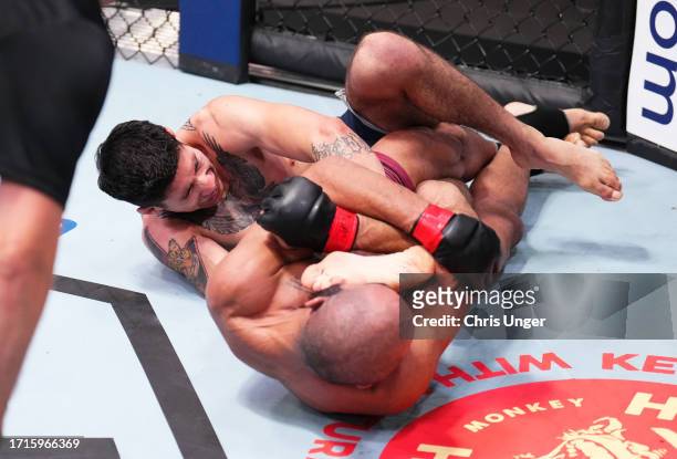 Victor Hugo of Brazil secures a knee bar submission against Eduardo Torres Caut of Chile in a bantamweight fight during Dana White's Contender Series...