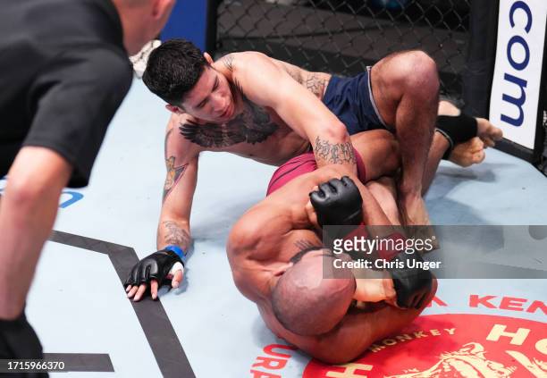 Victor Hugo of Brazil secures a knee bar submission against Eduardo Torres Caut of Chile in a bantamweight fight during Dana White's Contender Series...