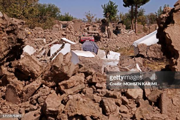 This photograph shows a general view of damaged houses after earthquake in Wardakha village, Zendeh Jan district of Herat province on October 10,...