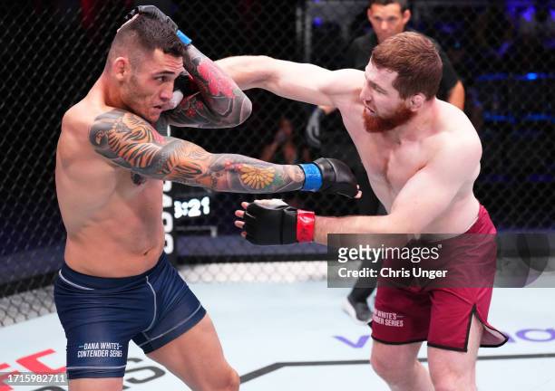Murtaza Talha of Russia punches Rodolfo Bellato of Brazil in a light heavyweight fight during Dana White's Contender Series season seven, week nine...
