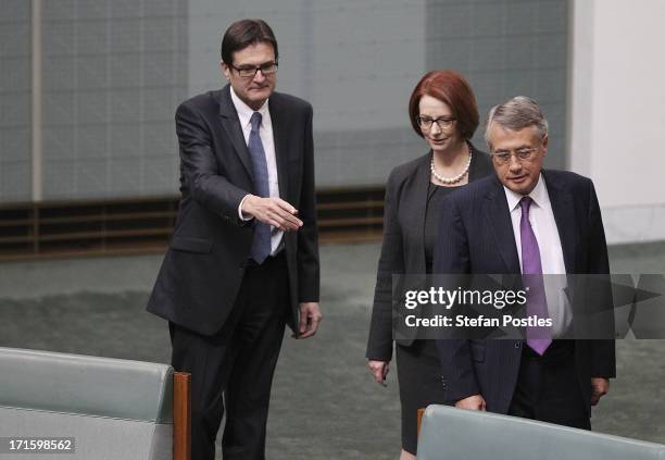 Former PM Julia Gillard is flanked by former ministers Greg Combet and Wayne Swan during House of Representatives question time on June 27, 2013 in...