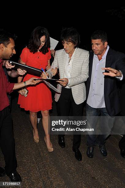 Sally Humphreys and Ronnie Wood sighting leaving the Serpentine Summer Party on June 26, 2013 in London, England.