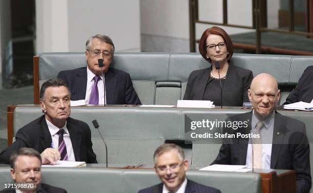 Former PM Julia Gillard and former ministers Wayne Swan , Craig Emerson , and Peter Garrett sit on the back bench during House of Representatives...