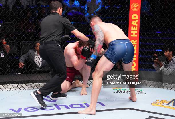 Rodolfo Bellato of Brazil punches Murtaza Talha of Russia in a light heavyweight fight during Dana White's Contender Series season seven, week nine...