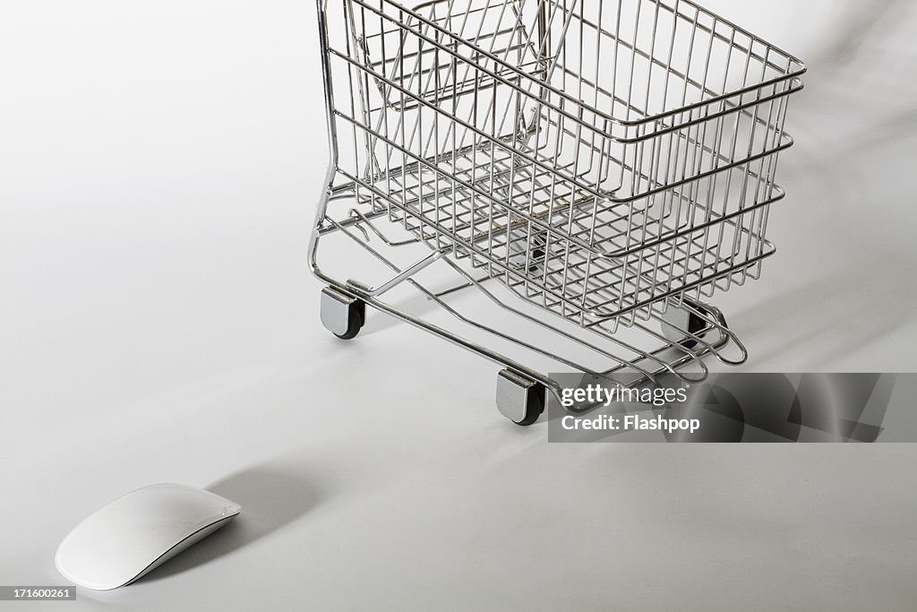 Computer mouse and empty shopping trolley