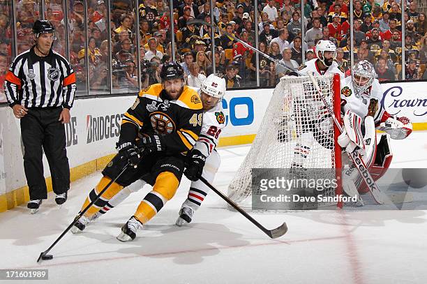 Rich Peverley of the Boston Bruins battles with Michal Handzus of the Chicago Blackhawks during Game Six of the 2013 Stanley Cup Final at TD Garden...
