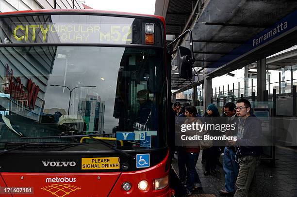 Commuters board a bus outside Parramatta train station in western Sydney, Australia, on Monday, June 24, 2013. Chris Bowen, a key backer of returned...