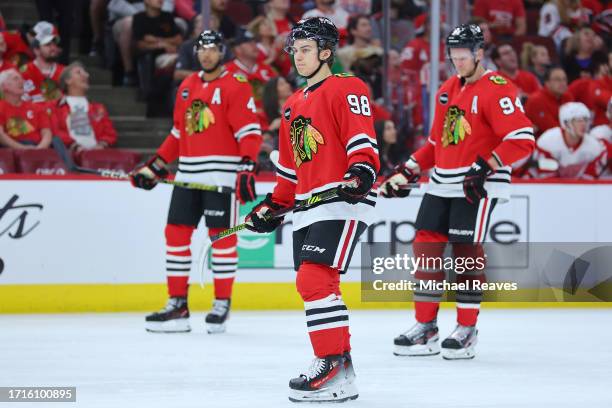 Connor Bedard of the Chicago Blackhawks looks on against the Detroit Red Wings during the third period of preseason game at the United Center on...