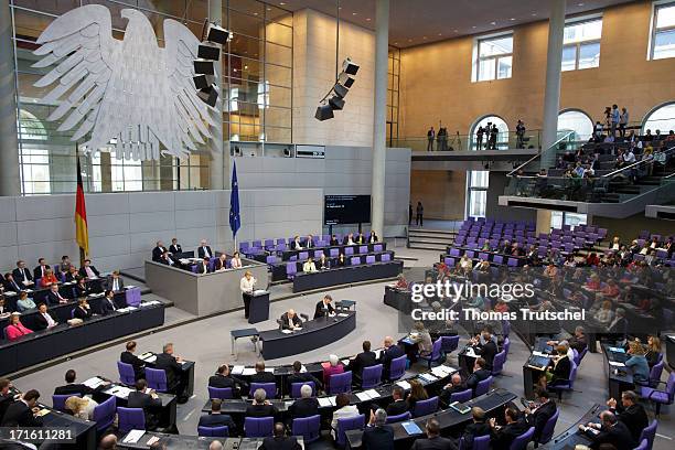 German Chancellor Angela Merkel gives a government declaration on the annual G8 leaders summit on European Council meeting at the Reichstag, the seat...