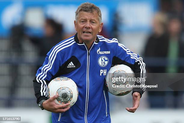 Assistant coach Peter Herrmann shouts during a FC Schalke 04 training session on June 27, 2013 in Gelsenkirchen, Germany.
