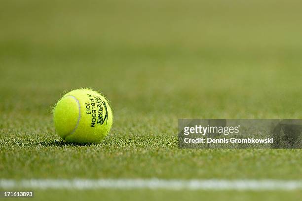 Tennis ball rests on the turf during the Ladies' Singles second round match between Petra Martic of Croatia and Karolina Pliskova of Czech Republic...