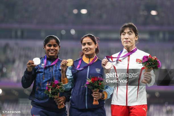 Silver medalist Nadeesha Dilhan Lekamge Hatarabage of Team Sri Lanka, gold medalist Annu Rani of Team India and bronze medalist Lyu Huihui of Team...
