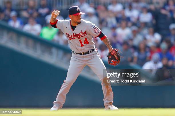 Ildemaro Vargas of the Washington Nationals throws to first during the third inning against the Atlanta Braves at Truist Park on October 1, 2023 in...