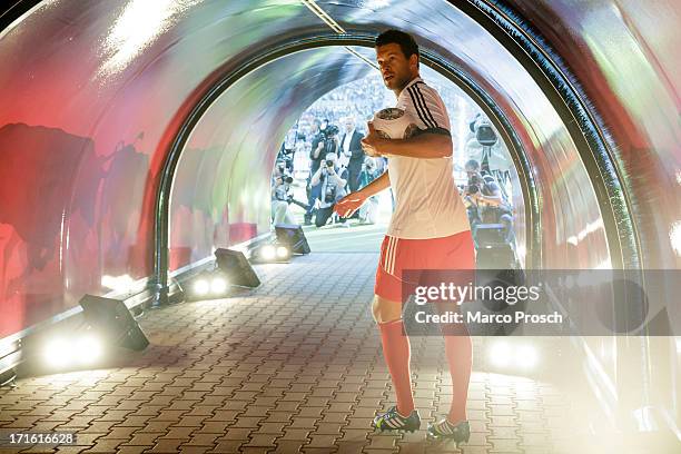 Michael Ballack walks toward the pitch during the Michael Ballack farewell match 'Ciao Capitano' at the Red Bull Arena on June 5, 2013 in Leipzig,...