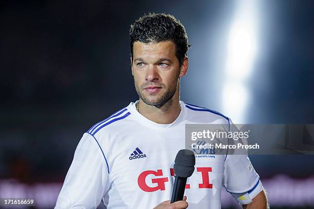 Visibly moved Michael Ballack speaks to his fans on the pitch after the Michael Ballack farewell match 'Ciao Capitano' at the Red Bull Arena on June...