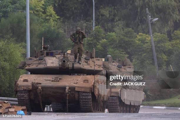 Israeli army Merkava tanks are positioned near the border with Gaza in southern Israel on October 10, 2023. Israel pounded Hamas targets in Gaza on...
